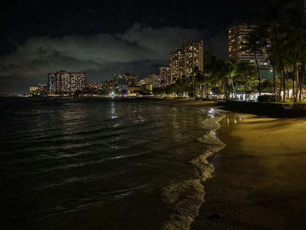 Waves roll on to an empty Waikiki Beach on Tuesday evening in Honolulu.
