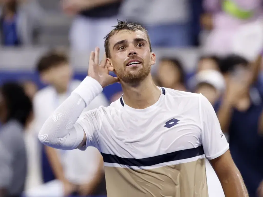 France's Benjamin Bonzi celebrates after winning his first round match against Russia's Daniil Medvedev at US Open