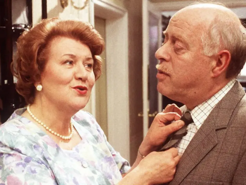 Dame Patricia as Hyacinth Bucket with Clive Swift as long-suffering husband Richard in Keeping Up Appearances