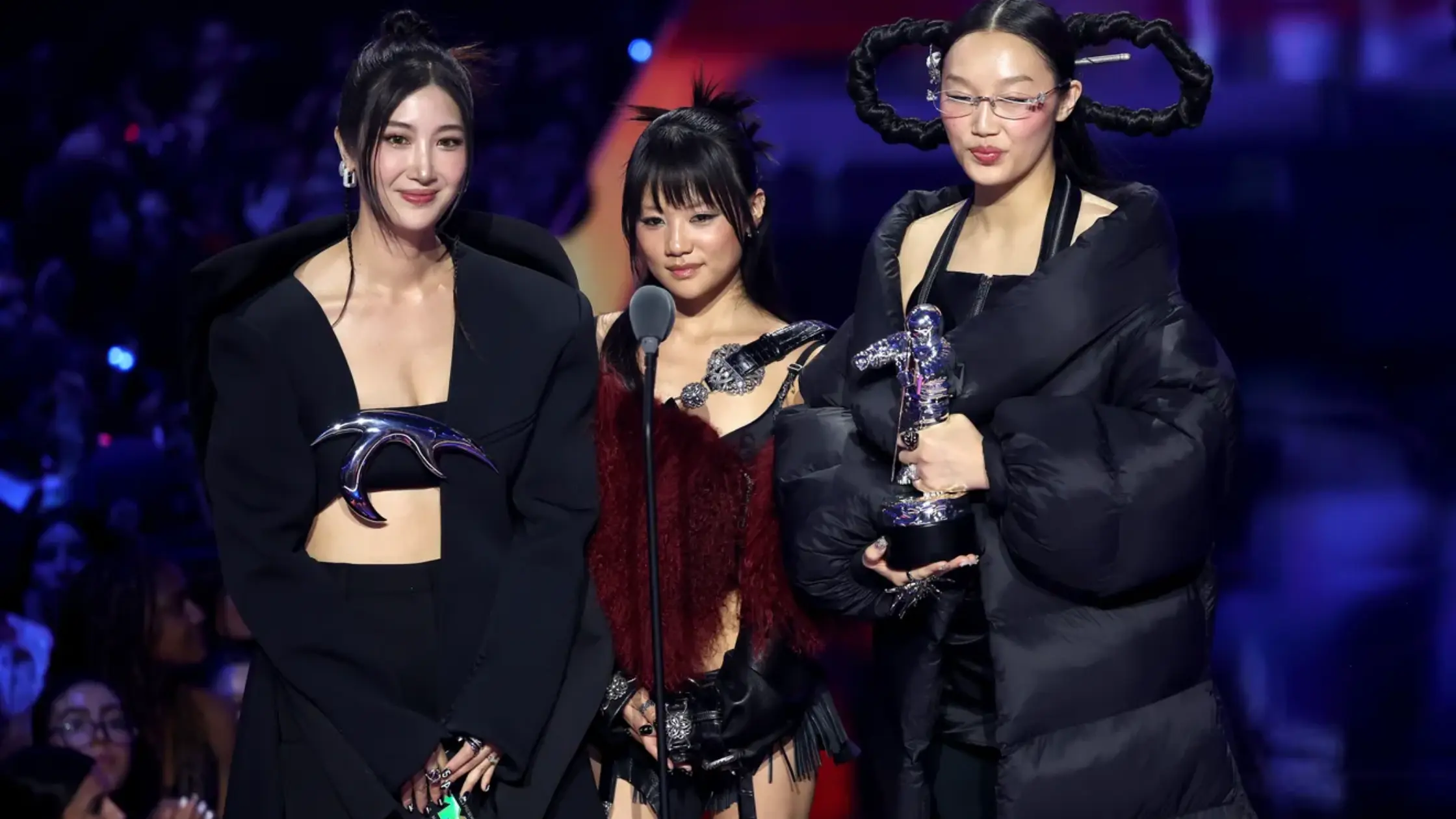 EJAE, REI AMI and Audrey Nuna of HUNTR/X from “KPop Demon Hunters” speak onstage during the 2025 MTV video